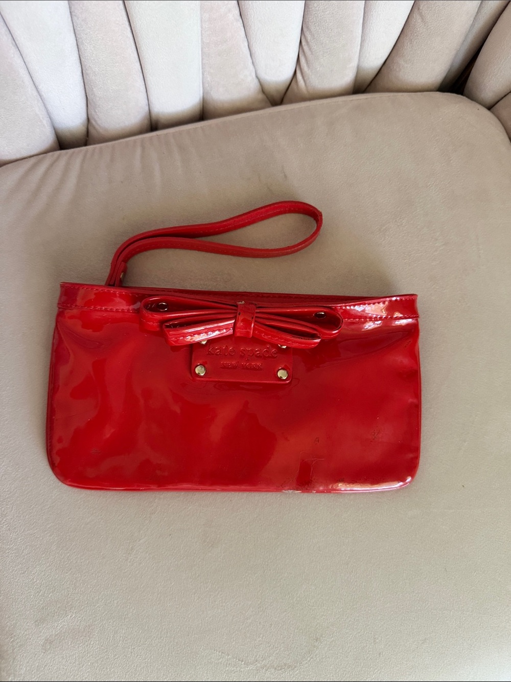 kate spade red patent wristlet with bow detail